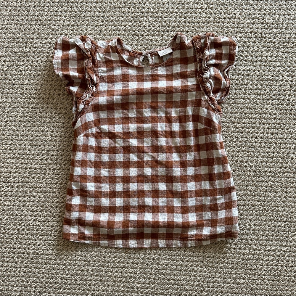 Plaid blouse with ruffled shoulders